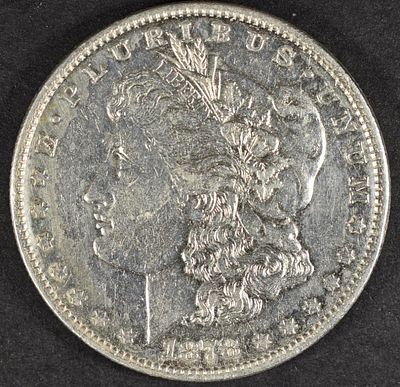 1878 7TF REV 79 MORGAN DOLLAR AU. LEADERS IN ON-LINE AUCTIONS ESTIMATE $100 - $130.