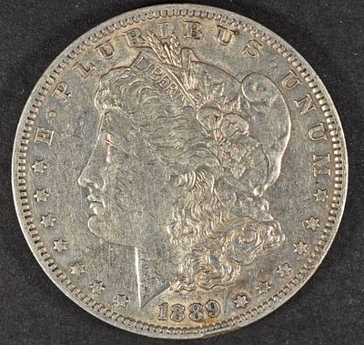1889-O MORGAN DOLLAR AU. BID WITH SILVER CITY AUCTIONS ESTIMATE $130 - $150.