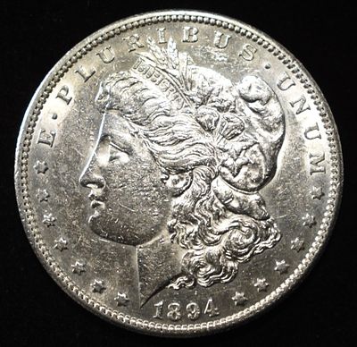 1894-S MORGAN DOLLAR CH AU. CHECK OUT OUR UPCOMING AUCTIONS ESTIMATE $800 - $900.