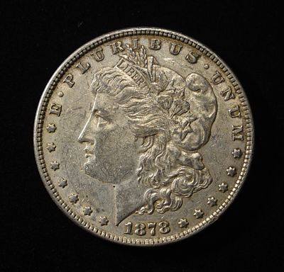 1878 7TF REV. 78 MORGAN DOLLAR XF/AU. BID WITH SILVER CITY AUCTIONS ESTIMATE $70 - $90.