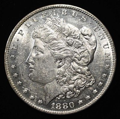 1880-O MORGAN DOLLAR AU/BU. LEADERS IN ON-LINE AUCTIONS ESTIMATE $120 - $150.