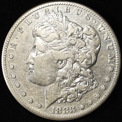 1883-S MORGAN DOLLAR XF. WEEKLY COIN & CURRENCY AUCTIONS ESTIMATE $100 - $120.