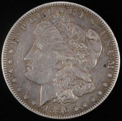 1886-O MORGAN DOLLAR XF. TOP RATED AUCTION HOUSE ESTIMATE $100 - $130.
