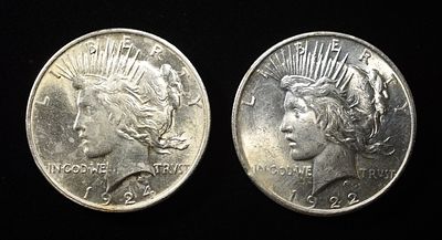 1922, 24 PEACE DOLLARS. CHECK OUT OUR UPCOMING AUCTIONS ESTIMATE $80 - $120.