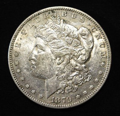 1879-O MORGAN DOLLAR AU. CHECK OUT OUR UPCOMING AUCTIONS ESTIMATE $75 - $100.