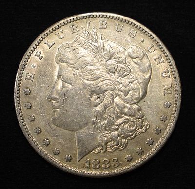 1883-S MORGAN DOLLAR AU. BID WITH SILVER CITY AUCTIONS ESTIMATE $200 - $250.