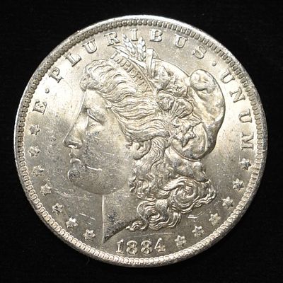 1884-O MORGAN DOLLAR BU. WEEKLY COIN & CURRENCY AUCTIONS ESTIMATE $75 - $100.
