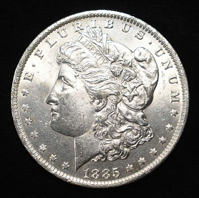1885-O MORGAN DOLLAR BU. LEADERS IN ON-LINE AUCTIONS ESTIMATE $75 - $100.
