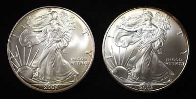 2003 & 2004 AMERICAN SILVER EAGLES. TOP RATED AUCTION HOUSE ESTIMATE $150 - $200.