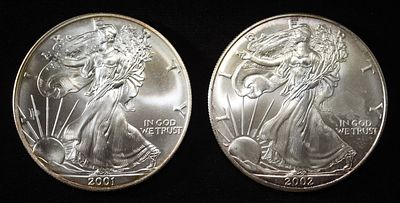 2001 & 2002 AMERICAN SILVER EAGLES. BID WITH SILVER CITY AUCTIONS ESTIMATE $150 - $200.