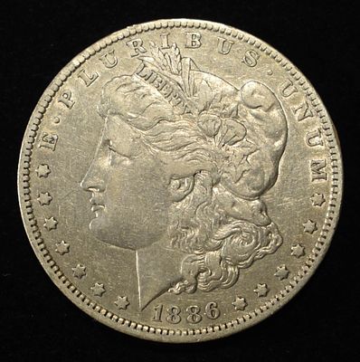 1886-O MORGAN DOLLAR XF. WEEKLY COIN & CURRENCY AUCTIONS ESTIMATE $100 - $120.