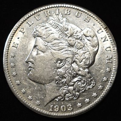 1903-S MORGAN DOLLAR AU. CHECK OUT OUR UPCOMING AUCTIONS ESTIMATE $2500 - $3000.