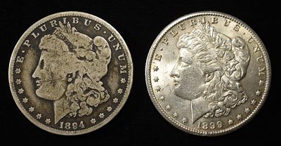 1894-O & 1899-O MORGAN DOLLARS. TOP RATED AUCTION HOUSE ESTIMATE $160 - $210.