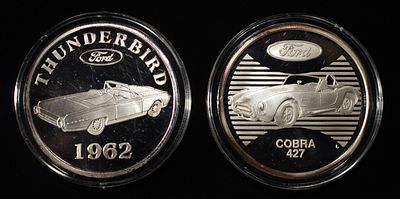 (2) FORD 1 OZ SILVER ROUNDs. BID WITH SILVER CITY AUCTIONS ESTIMATE $130 - $180.