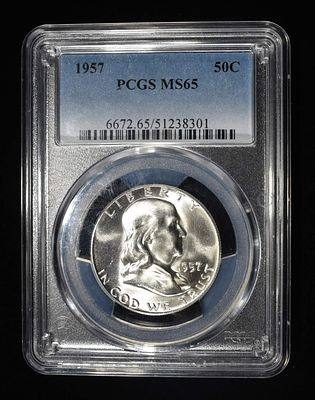 1957 FRANKLIN HALF DOLLAR PCGS MS-65. CHECK OUT OUR UPCOMING AUCTIONS ESTIMATE $75 - $100.