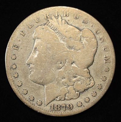 1879-CC MORGAN DOLLAR VG. CHECK OUT OUR UPCOMING AUCTIONS ESTIMATE $200 - $250.