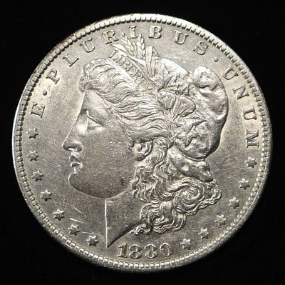 1880-O MORGAN DOLLAR AU. BID WITH SILVER CITY AUCTIONS ESTIMATE $80 - $100.