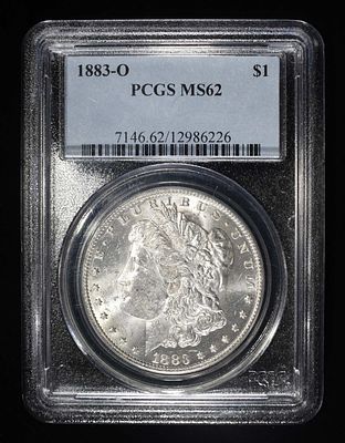 1883-O MORGAN DOLLAR PCGS MS62. CHECK OUT OUR UPCOMING AUCTIONS ESTIMATE $100 - $150.