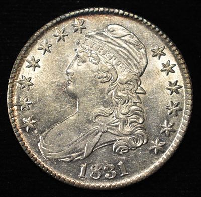 1831 BUST HALF DOLLAR BU. LEADERS IN ON-LINE AUCTIONS ESTIMATE $900 - $1000.