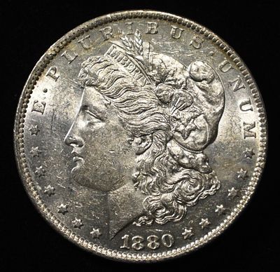 1880-O MORGAN DOLLAR BU. CHECK OUT OUR UPCOMING AUCTIONS ESTIMATE $160 - $200.