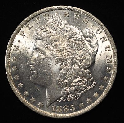 1883-O MORGAN DOLLAR BU. BID WITH SILVER CITY AUCTIONS ESTIMATE $100 - $130.