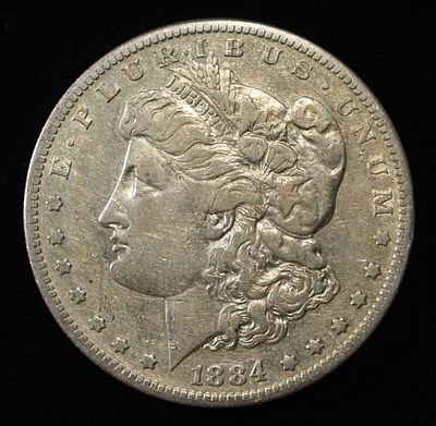 1884-S MORGAN DOLLAR XF. LEADERS IN ON-LINE AUCTIONS ESTIMATE $130 - $150.