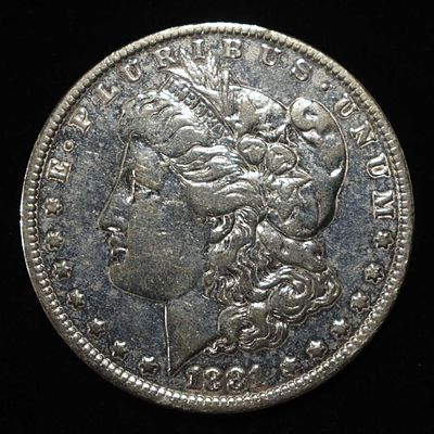 1881-O MORGAN DOLLAR CLEANED. LEADERS IN ON-LINE AUCTIONS ESTIMATE $100 - $150.