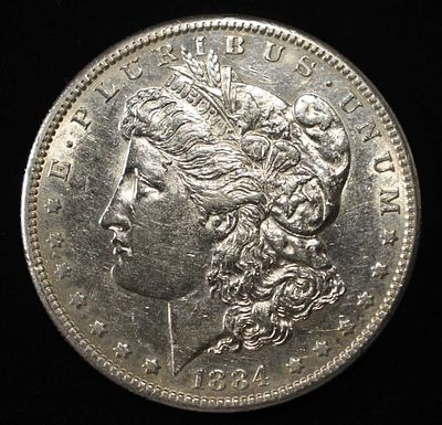 1884-S MORGAN DOLLAR CH AU. LEADERS IN ON-LINE AUCTIONS ESTIMATE $1500 - $2000.