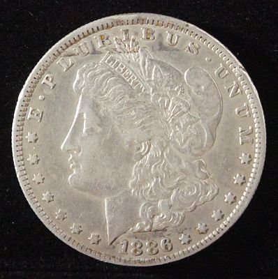 1886-O MORGAN DOLLAR XF. WEEKLY COIN & CURRENCY AUCTIONS ESTIMATE $100 - $130.
