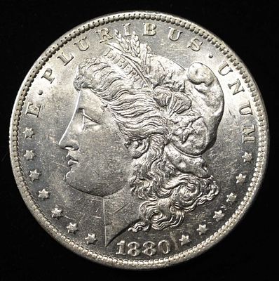 1880-O MORGAN DOLLAR BU. CHECK OUT OUR UPCOMING AUCTIONS ESTIMATE $150 - $200.