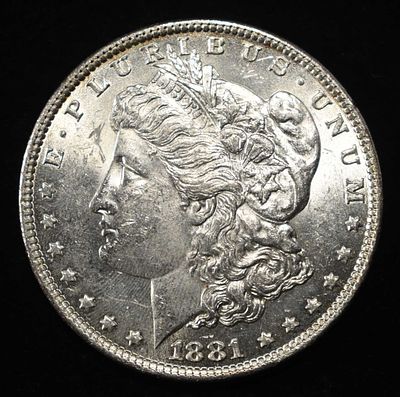 1881-O MORGAN DOLLAR AU/BU. LEADERS IN ON-LINE AUCTIONS ESTIMATE $100 - $150.