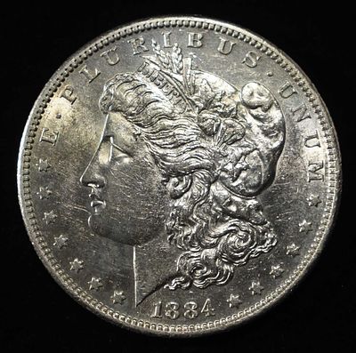 1884-S MORGAN DOLLAR AU/BU. TOP RATED AUCTION HOUSE ESTIMATE $3000 - $3500.