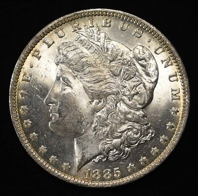 1885-O MORGAN DOLLAR. BID WITH SILVER CITY AUCTIONS ESTIMATE $90 - $130.