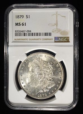 1879 MORGAN DOLLAR NGC MS61. CHECK OUT OUR UPCOMING AUCTIONS ESTIMATE $90 - $130.