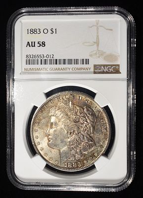 1883-O MORGAN DOLLAR NGC AU58. CHECK OUT OUR UPCOMING AUCTIONS ESTIMATE $90 - $130.