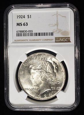 1924 PEACE DOLLAR NGC MS-63. BID WITH SILVER CITY AUCTIONS ESTIMATE $120 - $150.