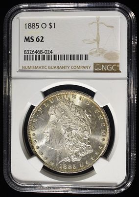 1885-O MORGAN DOLLAR NGC MS62. TOP RATED AUCTION HOUSE ESTIMATE $90 - $130.