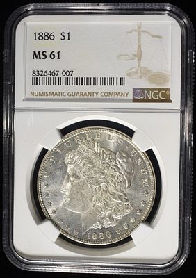 1886 MORGAN DOLLAR NGC MS61. CHECK OUT OUR UPCOMING AUCTIONS ESTIMATE $80 - $120.