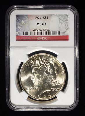 1924 PEACE DOLLAR NGC MS-63. BID WITH SILVER CITY AUCTIONS ESTIMATE $120 - $150.