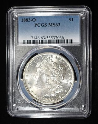 1883-O MORGAN DOLLAR PCGS MS-63. CHECK OUT OUR UPCOMING AUCTIONS ESTIMATE $130 - $150.