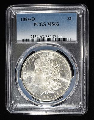 1884-O MORGAN DOLLAR PCGS MS-63. CHECK OUT OUR UPCOMING AUCTIONS ESTIMATE $130 - $150.