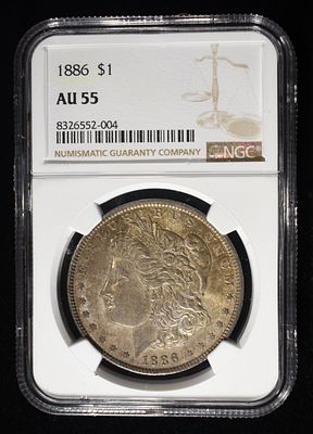 1886 MORGAN DOLLAR NGC AU55. CHECK OUT OUR UPCOMING AUCTIONS ESTIMATE $90 - $130.