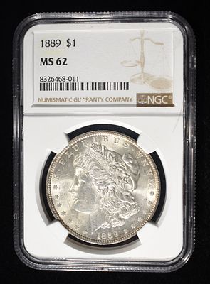 1889 MORGAN DOLLAR NGC MS62. CHECK OUT OUR UPCOMING AUCTIONS ESTIMATE $90 - $130.