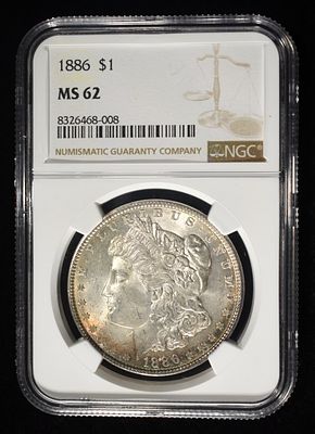1886 MORGAN DOLLAR NGC MS62. LEADERS IN ON-LINE AUCTIONS ESTIMATE $90 - $130.
