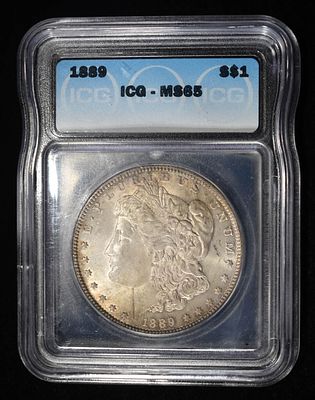1889 MORGAN DOLLAR ICG MS65. BID WITH SILVER CITY AUCTIONS ESTIMATE $280 - $330.