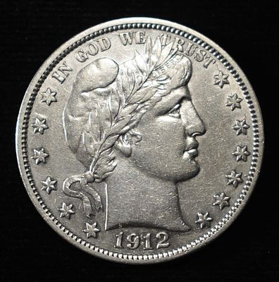 1912-S BARBER HALF AU. BID WITH SILVER CITY AUCTIONS ESTIMATE $350 - $400.