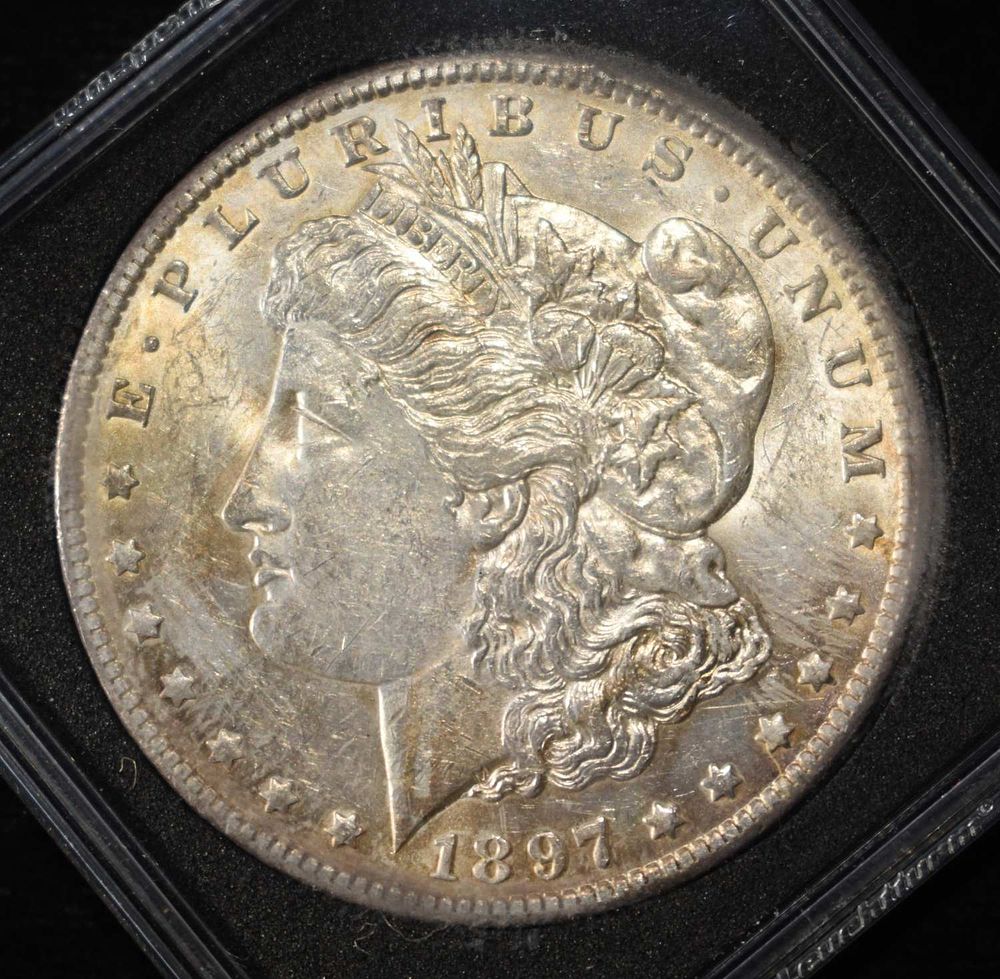 1897-O MORGAN DOLLAR BU. LEADERS IN ON-LINE AUCTIONS ESTIMATE $1200 - $1400.