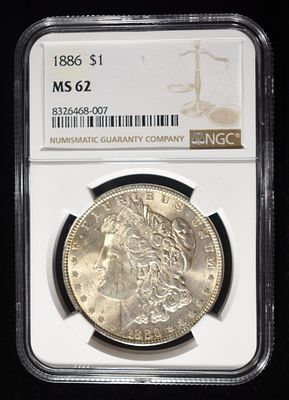 1886 MORGAN DOLLAR NGC MS62. TOP RATED AUCTION HOUSE ESTIMATE $90 - $130.