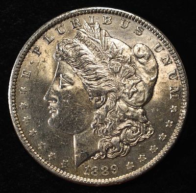 1889 MORGAN DOLLAR BU. BID WITH SILVER CITY AUCTIONS ESTIMATE $120 - $170.