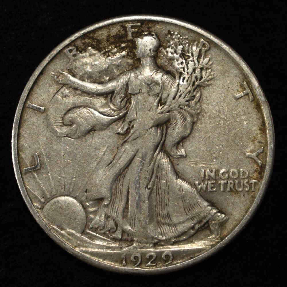 1929-D WALKING LIBERTY HALF XF. BID WITH SILVER CITY AUCTIONS ESTIMATE $150 - $200.